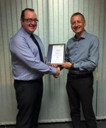 Skillweb CEO Paul Ridden is 
presented with the certification